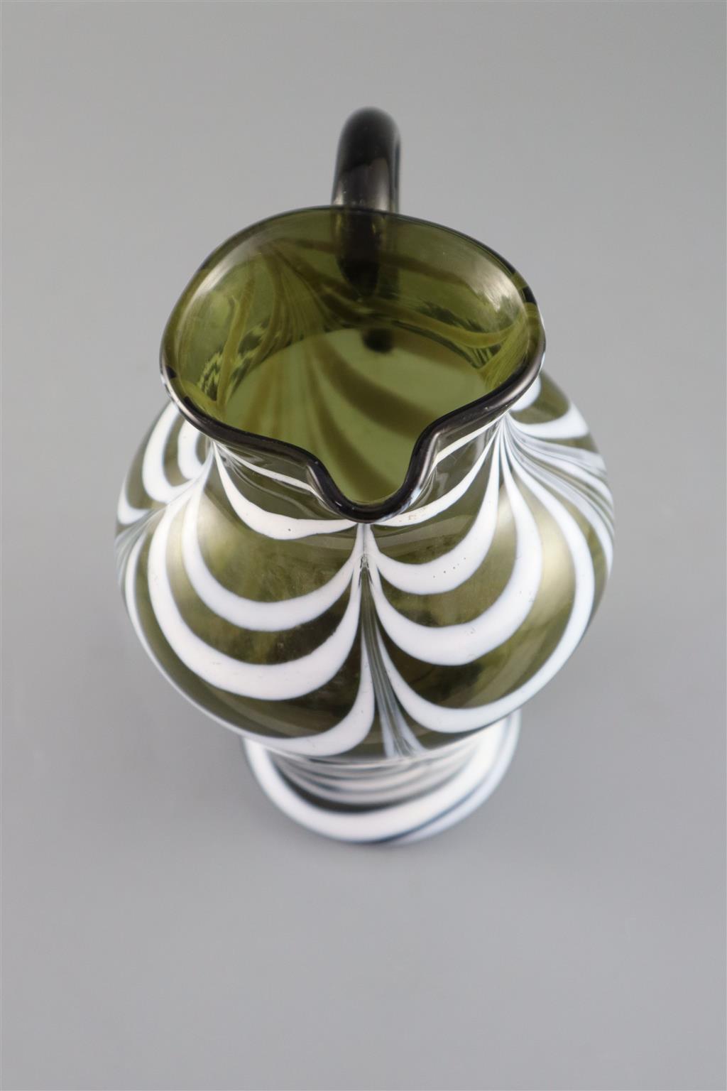 A George III green and white feather trailed glass jug, c.1800, 19cm high